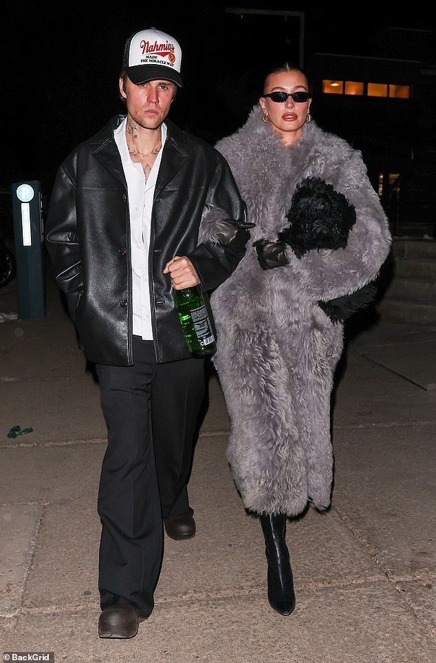 As she emerged at night in a long, chic light gray coat as she and her husband, 29, had a date night