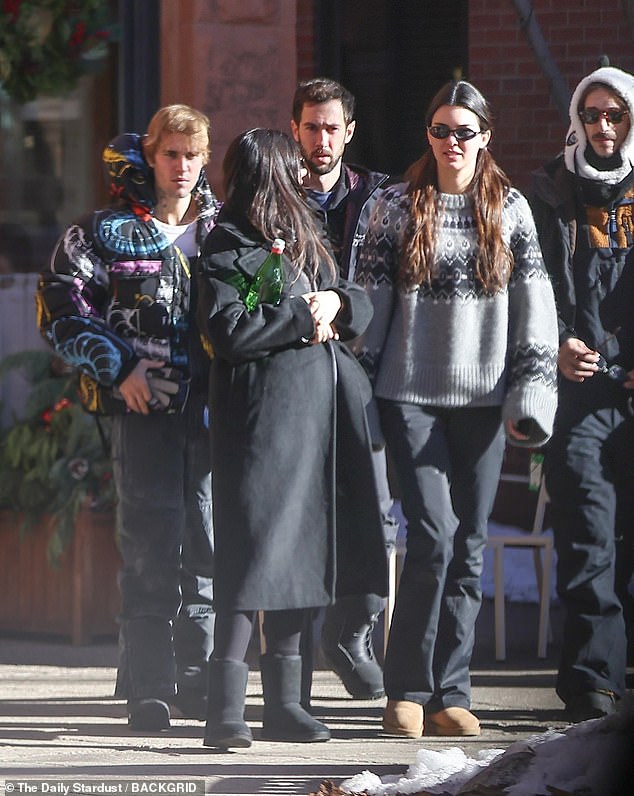 He was accompanied by Kendall, who also wore black snow pants and a pair of tan Ugg boots