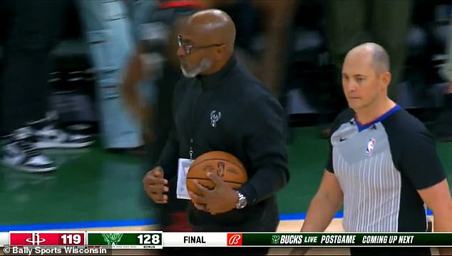 Bucks assistant coach Danny Carter took the game ball from an official after Sunday's game