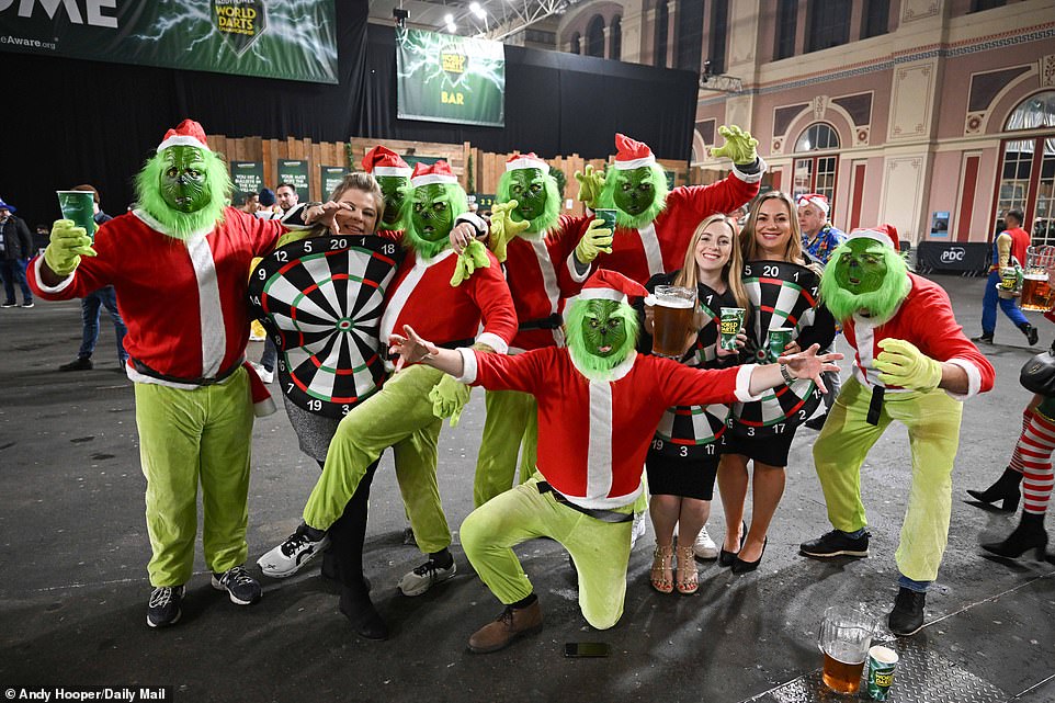 A group came dressed as the Grinch and gathered for a photo at the bar, while others carried large dartboards