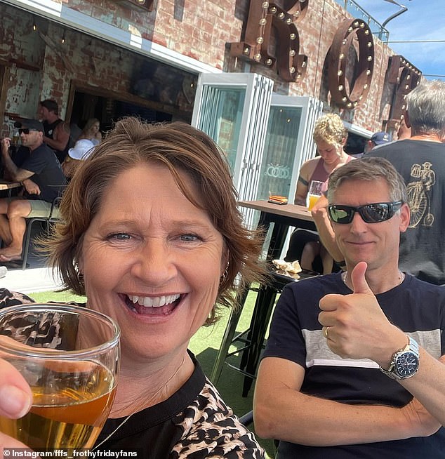 A couple posed for a photo while enjoying drinks on the outdoor patio