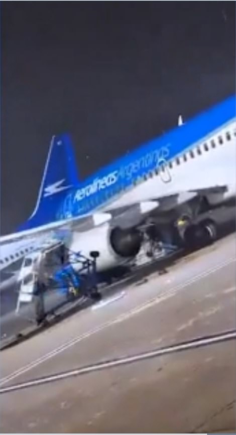 It collided with the stairs, causing it to fall to the ground as the plane turned sideways