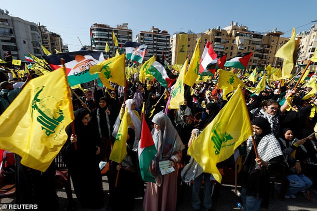 Lebanese Hezbollah supporters gather to attend a ceremony honoring fighters killed in the recent escalation with Israel last month