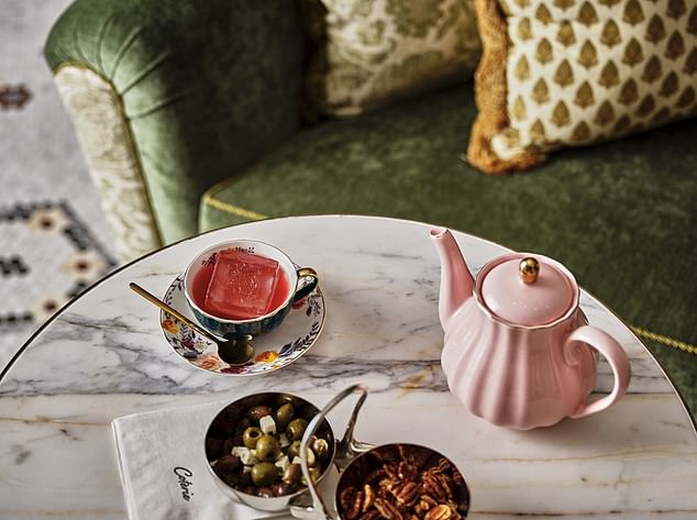 Jane enjoys a Destruction of Tea cocktail (pictured) from the new Coterie bar at the Four Seasons Hotel Boston, named after the original term given to The Boston Tea Party