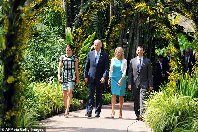 Then-Vice President Joe Biden walks with his daughter Ashley Biden, wife Jill Biden and son-in-law Howard Krien during a visit to the National Orchid Garden in Singapore in 2013