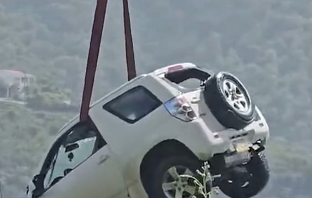 Detective France's vehicle is lifted from the water after it was found in October