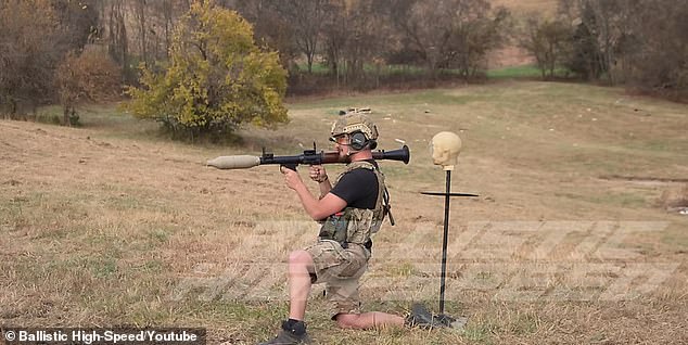 Everything seems to be going smoothly as Knowles prepares to demonstrate the impact of an RPG recoil on a ballistic dummy placed directly behind him.