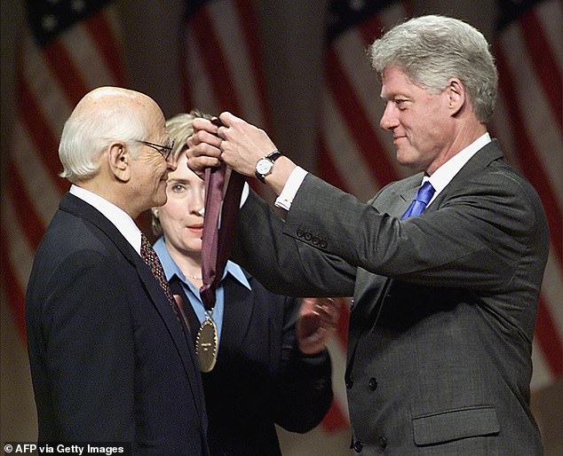 Former President Bill Clinton is seen here next to Hillary Clinton presenting Lear with the 1999 National Medal of Arts and Humanities Award