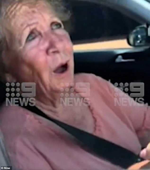 The elderly driver fights back tears as she tells the postman: 'I didn't see you'