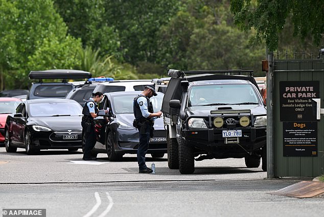 Police were seen speaking to drivers as they left the zoo