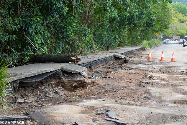 Flood damaged roads can be seen in the Cairns suburb of Caravonica