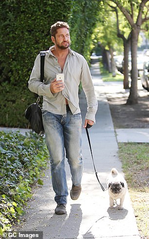 Actor Gerard Butler was photographed walking his dog