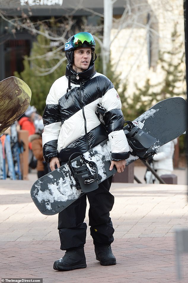 Justin, in turn, modeled a large, puffy jacket with thick black and white horizontal and diagonal stripes