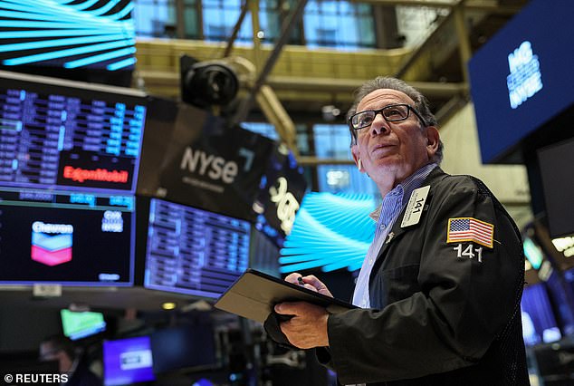 A trader is seen working at the New York Stock Exchange on November 16