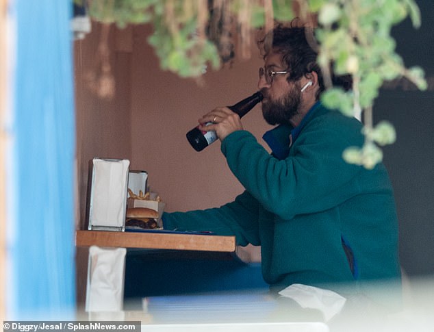 The actor wore AirPods as he enjoyed his lunch.  He retired from acting and reportedly works as a legal analyst