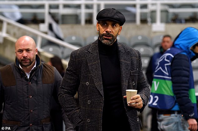 Ferdinand keeps his head covered during the recent match between Newcastle and AC Milan