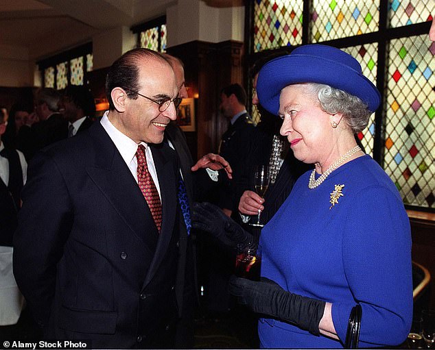 Sir David shares a joke with Queen Elizabeth II at the Almeida Theater in London in March 1999