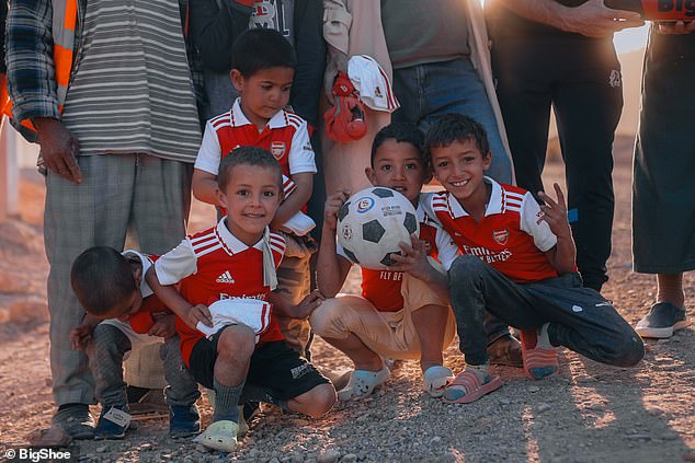 Children were seen wearing Arsenal shirts with Saka's name after the star's donation