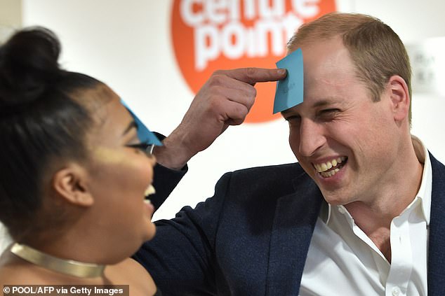 Prince William reacts as he plays a guessing game with 22-year-old Sherihan Sharis during his visit to a Centrepoint hostel in London on January 10, 2017. Some say you can see a resemblance to his mother when he smiles