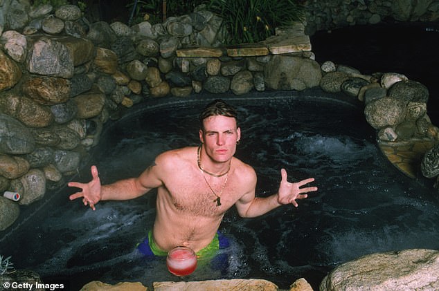 Rapper Vanilla Ice in his jacuzzi at home, circa 1990