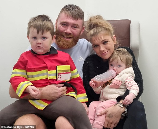 Mr Wells (pictured with his partner and two children), a 31-year-old forklift driver, arrived at William Harvey Hospital at 1am on November 13.  But he was not given a bed in the ward until November 14 at 10 p.m.