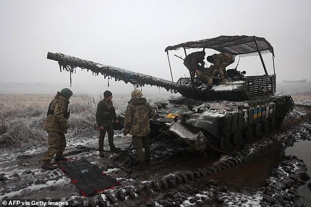 Ukrainian tank crews take part in an exercise not far from the front line towards Bakhmut, Donetsk region, on December 15, 2023