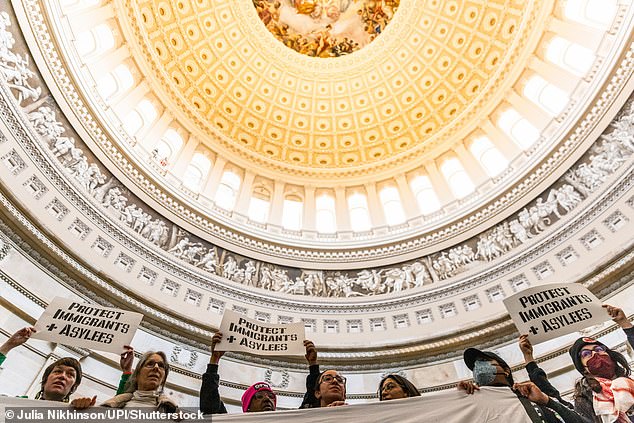 “Divesting militarism – investing in life,” read other signs that protesters waved above their heads.  'Protect immigrants and asylum seekers' and 'ceasefire' read others