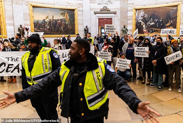 Protesters demonstrate in the U.S. Capitol Rotunda in Washington, DC on Tuesday, December 19, calling for a permanent ceasefire in the war between Israel and Hamas.