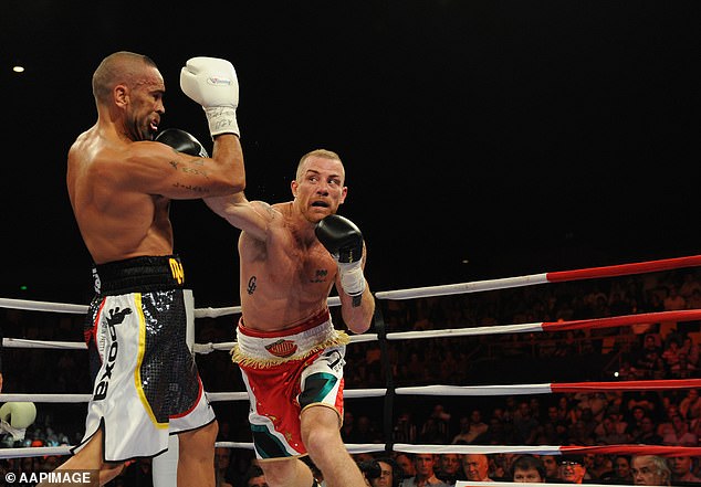 Wood (pictured during his win over Anthony Mundine) says he kept busy in prison by focusing on his fitness and keeping a low profile