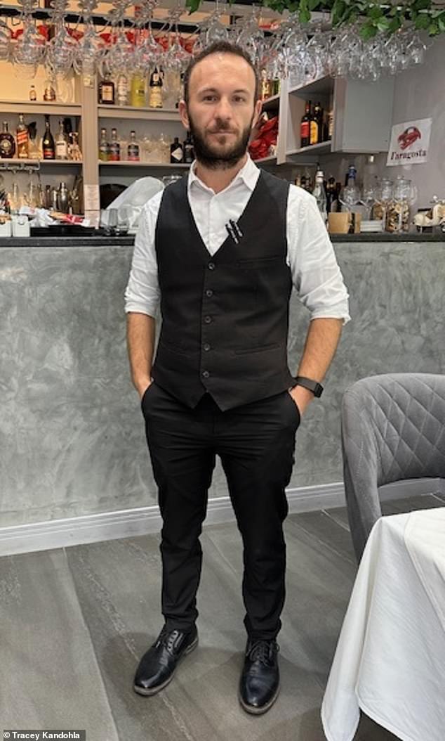 Restaurant manager Liri Kingji (pictured), 33, also helped free the female driver from the wreck on Saturday after she lost control of her vehicle and crashed into a lamppost in Olton near Solihull, West Midlands.