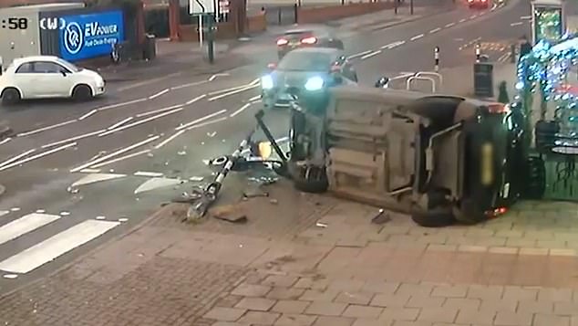 As the mother braces for impact and turns away from the car, it crashes into a nearby lamppost