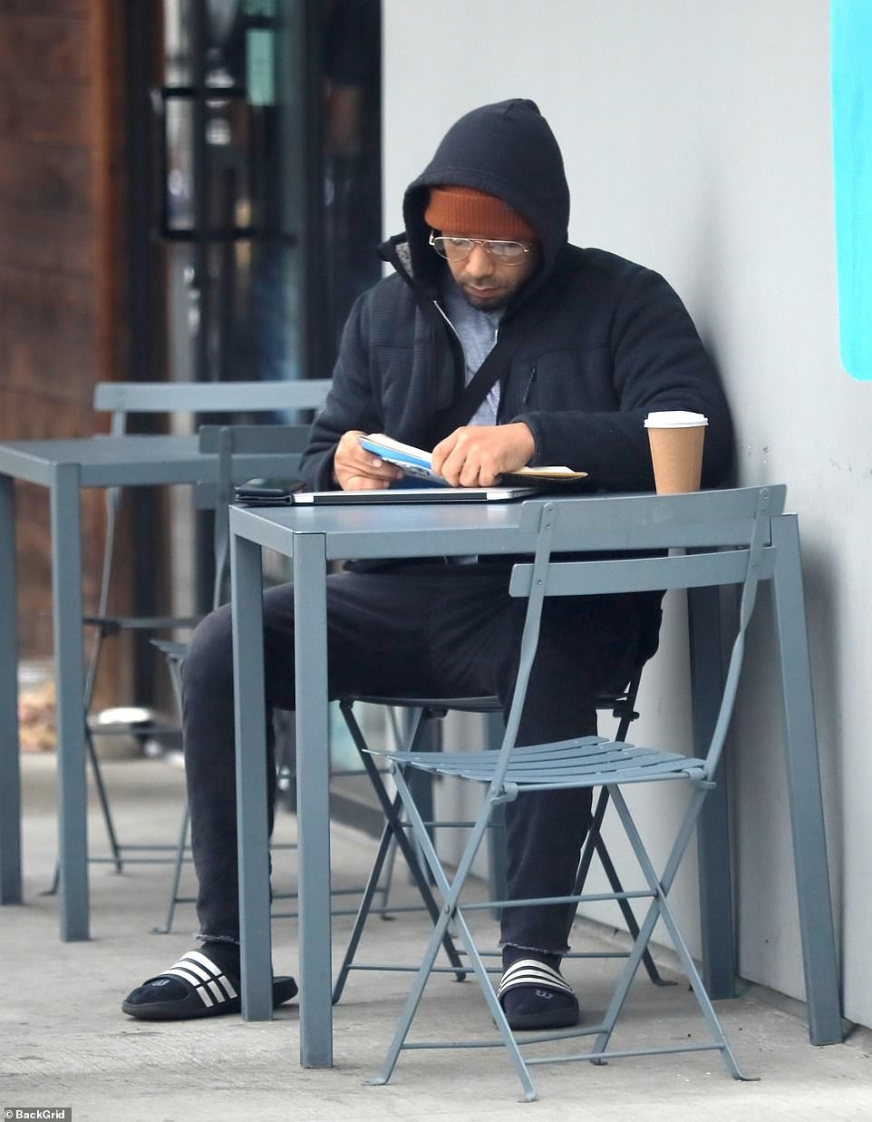 Focused: As he sat outside a coffee shop in Studio City, California, on Tuesday afternoon, the 41-year-old disgraced actor, who lost his appeal earlier this month following his conviction for orchestrating an anti-gay, racist attack on himself, appeared in seized in Perry's autobiography