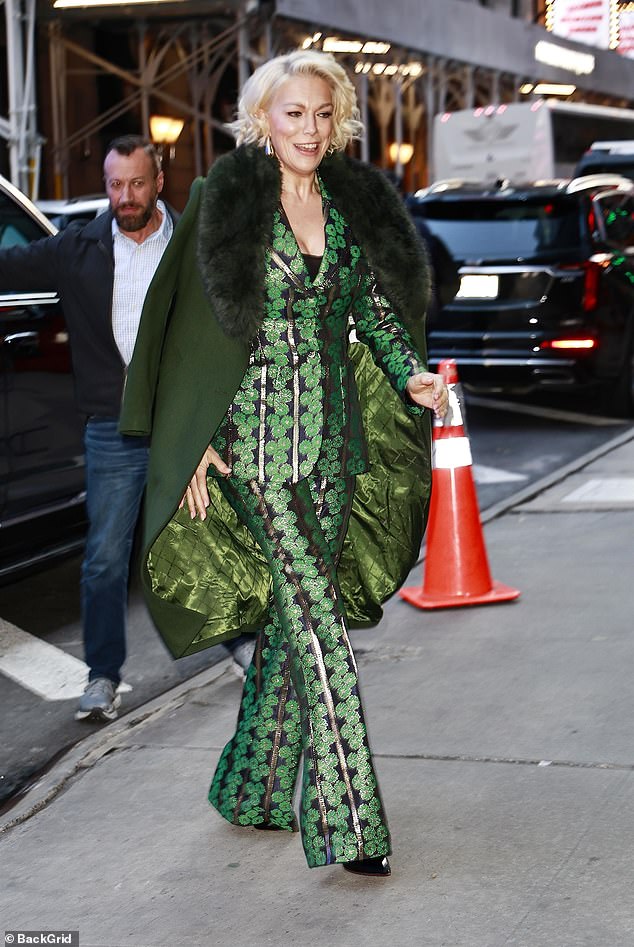 The Ted Lasso star, 49, wrapped warmly in a dark green coat with faux fur trim