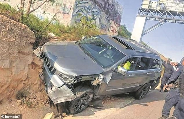 Officers in the state of Mexico stand by actor Octavio Ocaña's vehicle moments after he crashed on the road following an hour and 40 minute chase, during which a police officer fired multiple shots at Ocaña's SUV and his partner's vehicle into Ocaña's rammed.