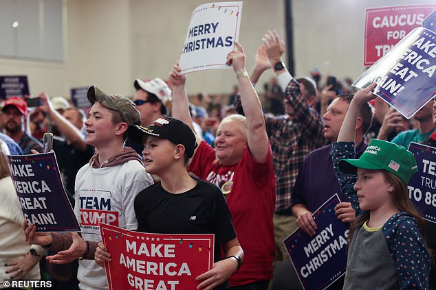 Supporters of Republican presidential candidate and former US President Donald Trump attend a campaign event in Waterloo, Iowa, USA, December 19, 2023