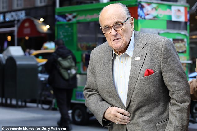 DailyMail.com spotted the 79-year-old, formerly known as 'America's Mayor', walking in Manhattan after doubling down on claims that have brought him to the brink of financial disaster