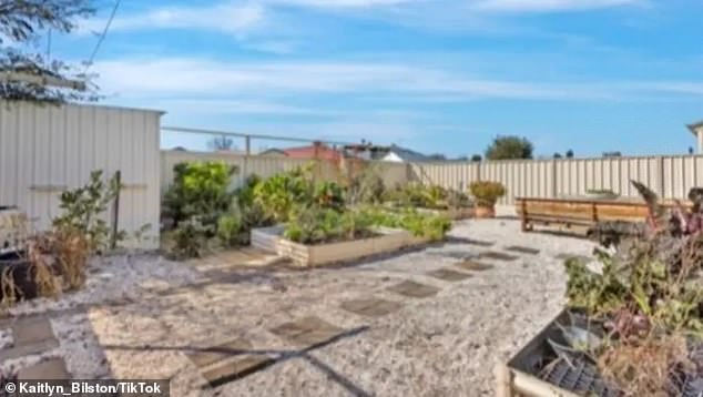 The photos received by the new owner showed a well-maintained space with gravel covering the garden, a few wooden park chairs and a table creating a serene outdoor setting