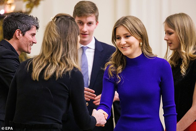 Elisabeth was elegant as ever in a cobalt blue dress with a turtleneck and some simple black boots