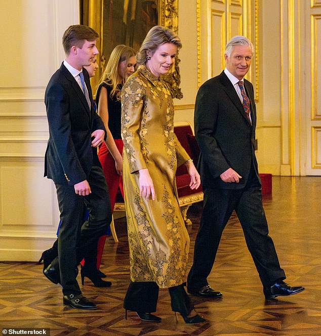 Meanwhile, her mother, Mathilde, lit up the room in a glitzy gold coat embroidered with floral motifs