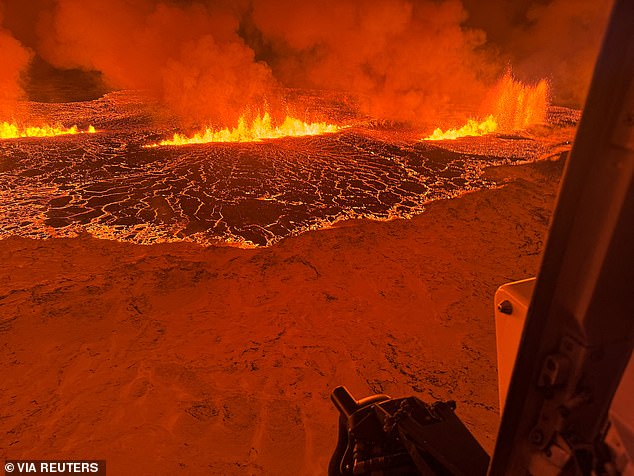 A volcano spews lava and smoke as it erupts north of Grindavik