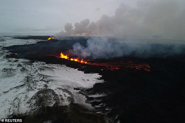 A drone photo shows lava spewing from the volcanic eruption site