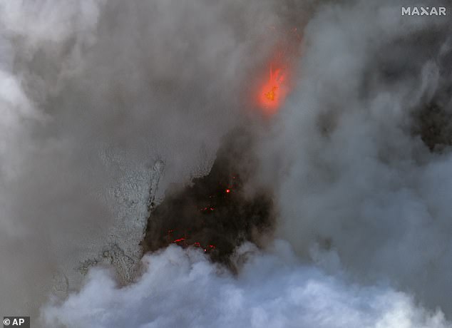 This satellite image from Maxar Technologies shows a close-up color infrared image of volcano and lava in Iceland on Tuesday