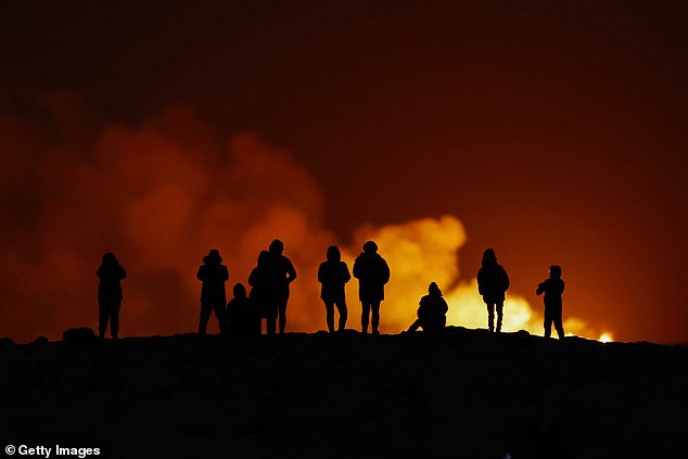 People view the volcano on the Reykjanes Peninsula in southwestern Iceland