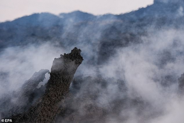 Smoke fills the air during a volcanic eruption, near the town of Grindavik