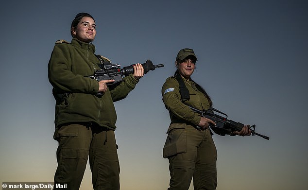 Ella Mizrach, 22, (left) and Hagar Abraham, 19, (right) raced through the Negev Desert, M16 assault rifles in hand to tackle Hamas and protect civilians