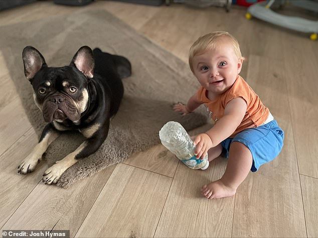 The beloved family pet, who is just one year and two months old, is the best friend of his one-year-old son Hugo (pictured together)