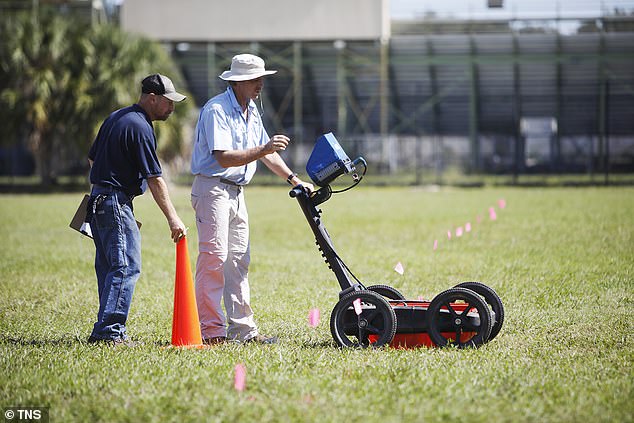 Scott Purcell, a senior geophysicist at GeoView, left, and Mike Wightman, president of GeoView, use ground-penetrating radar technology to scan part of the King High campus