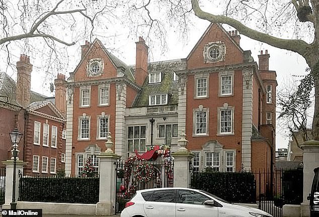 The raid was carried out at Ms Ecclestone's home in west London, which is pictured outside with Christmas decorations in this photo