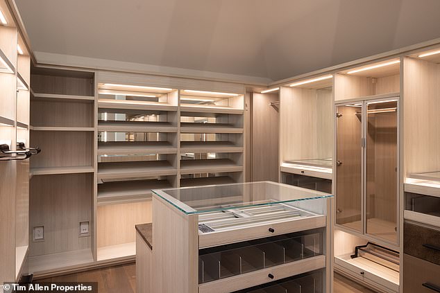 The huge master closet is equipped with extensive storage, shelves for hanging, drawers for clothing and jewelry and plenty of accent lighting to illuminate the space