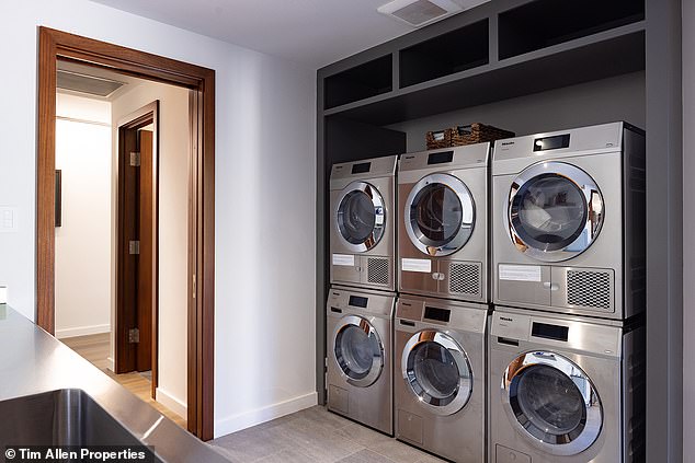 The laundry room is fully equipped with three washing machines, three dryers and a countertop with sink.  If the house sells for the asking price, it could set a record for the resort community